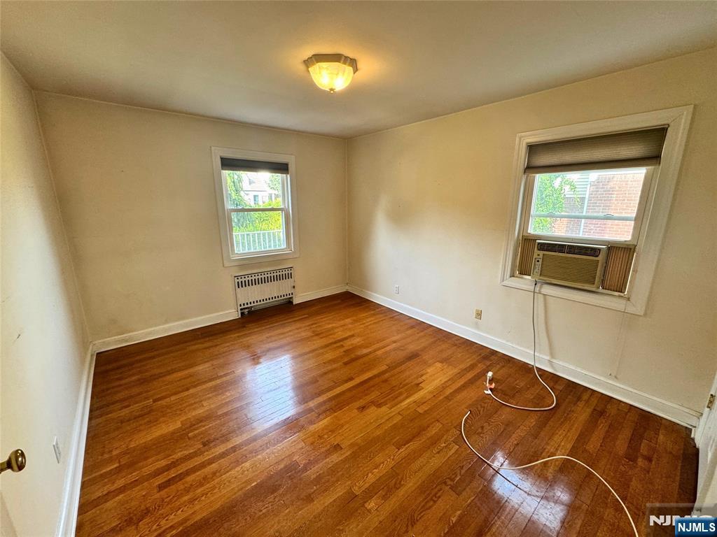 11-02 Charles Street Fair Lawn, NJ 07410 - Photo 11 of 15 a view of empty room with wooden floor and fan