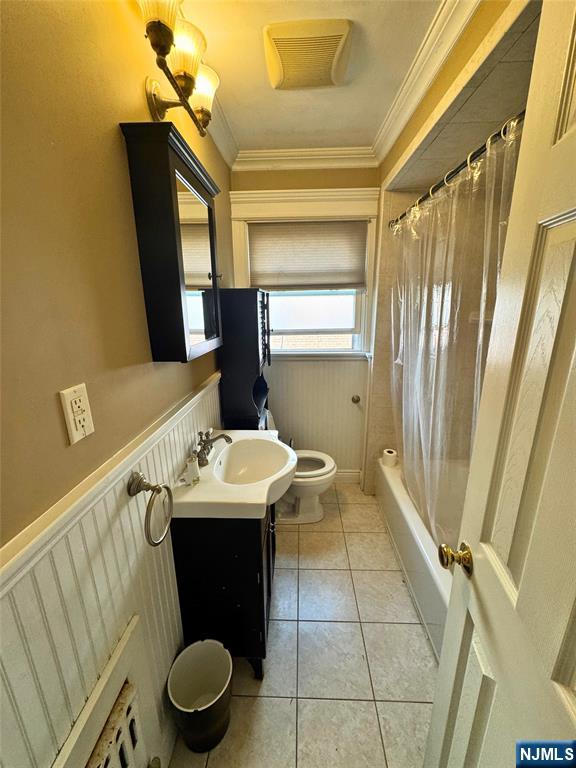 11-02 Charles Street Fair Lawn, NJ 07410 - Photo 12 of 15 a bathroom with a sink and a mirror