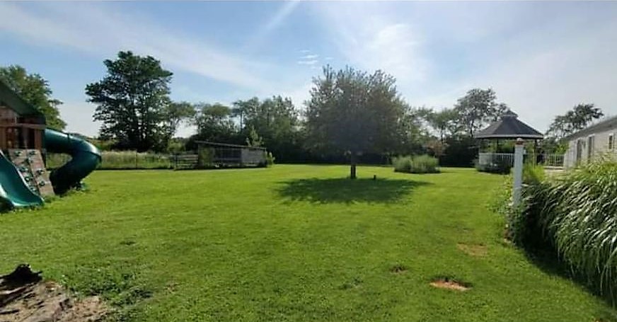 538 East 7500S Road Chebanse, IL 60922 - Photo 2 of 11 a view of a backyard with a garden and entertaining space