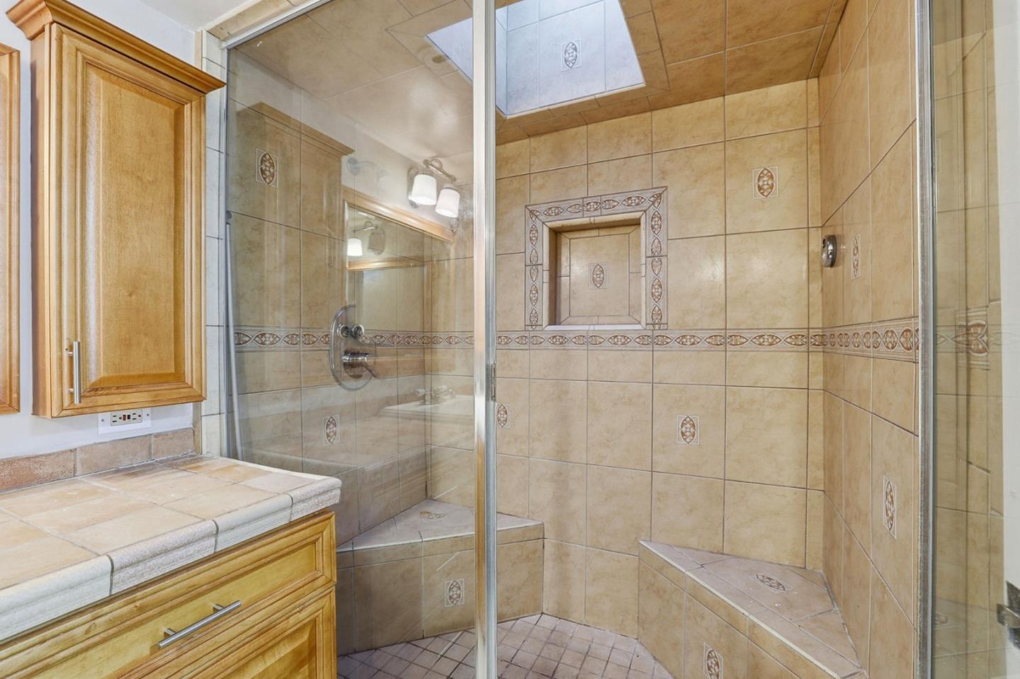 265 Brown Gables Road, Unit 11 Ben Lomond, CA 95005 - Photo 25 of 50 a bathroom with a granite countertop sink a mirror and shower