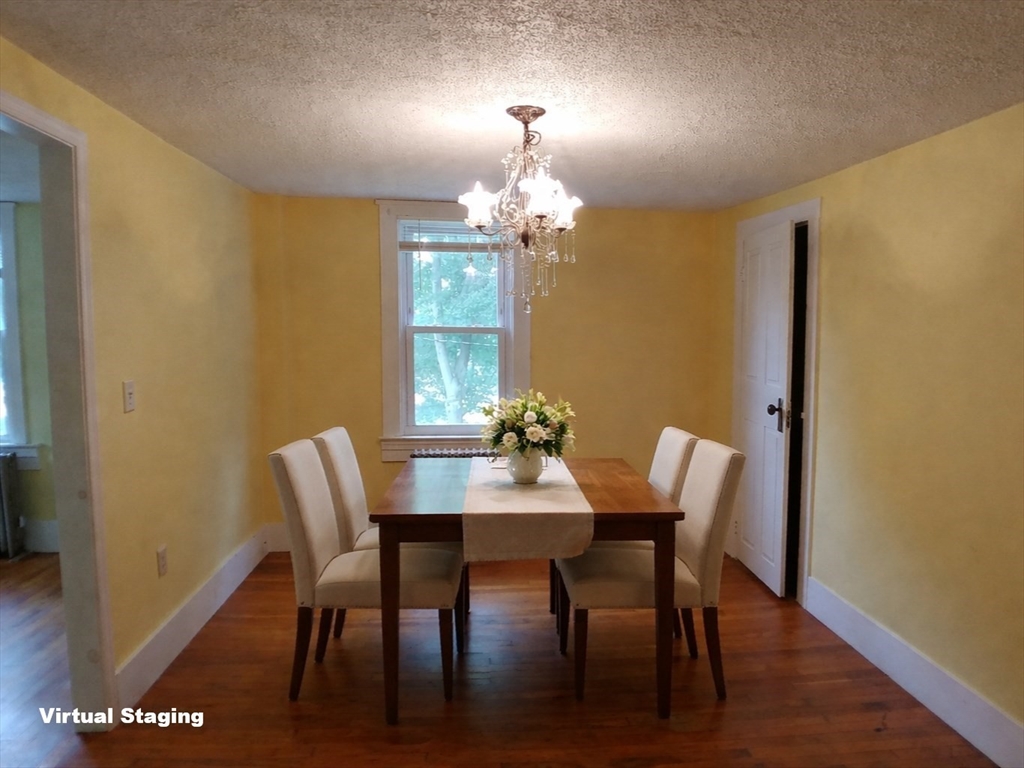 77 Hudson Street, Unit 2 Marlborough, MA 01752 - Photo 13 of 30 a view of a dining room with furniture and wooden floor