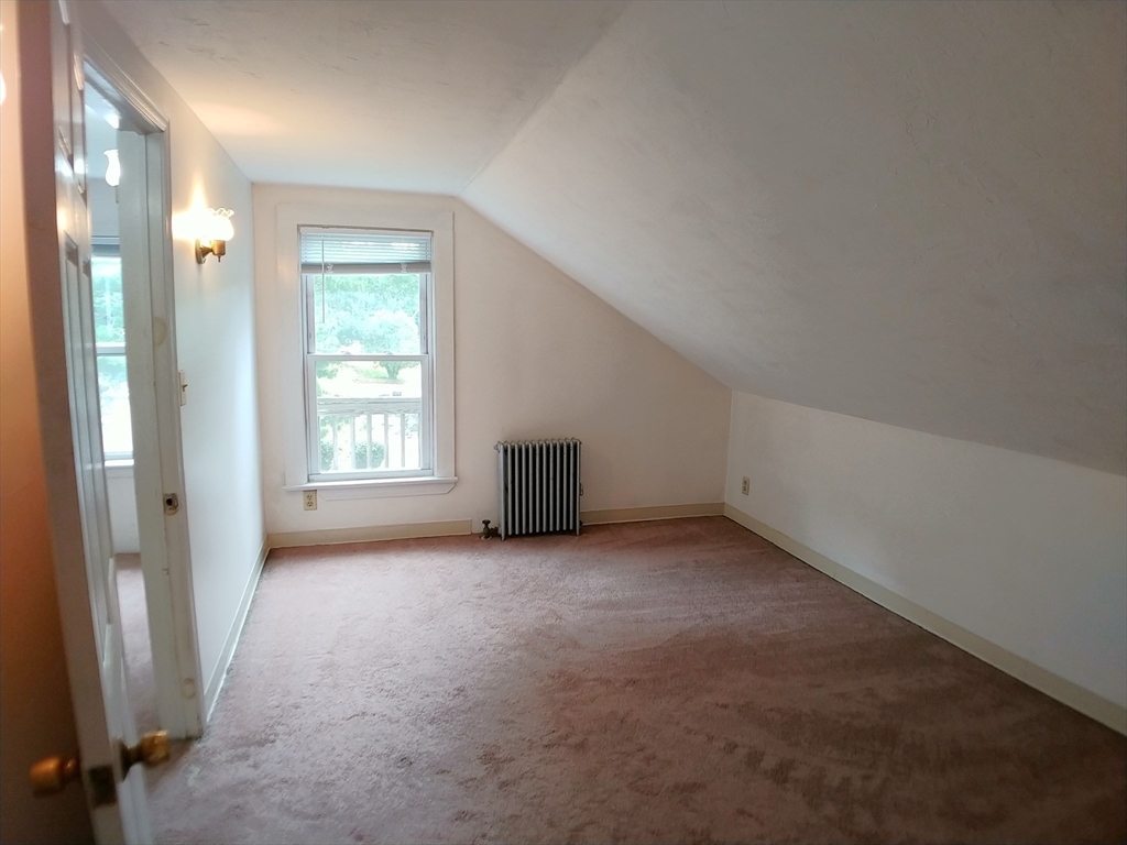 77 Hudson Street, Unit 2 Marlborough, MA 01752 - Photo 22 of 30 an empty room with windows