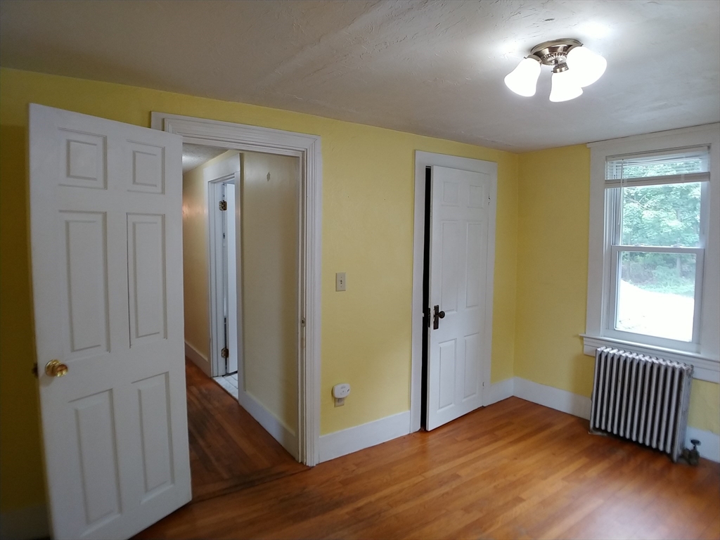 77 Hudson Street, Unit 2 Marlborough, MA 01752 - Photo 9 of 30 a view of empty room with wooden floor
