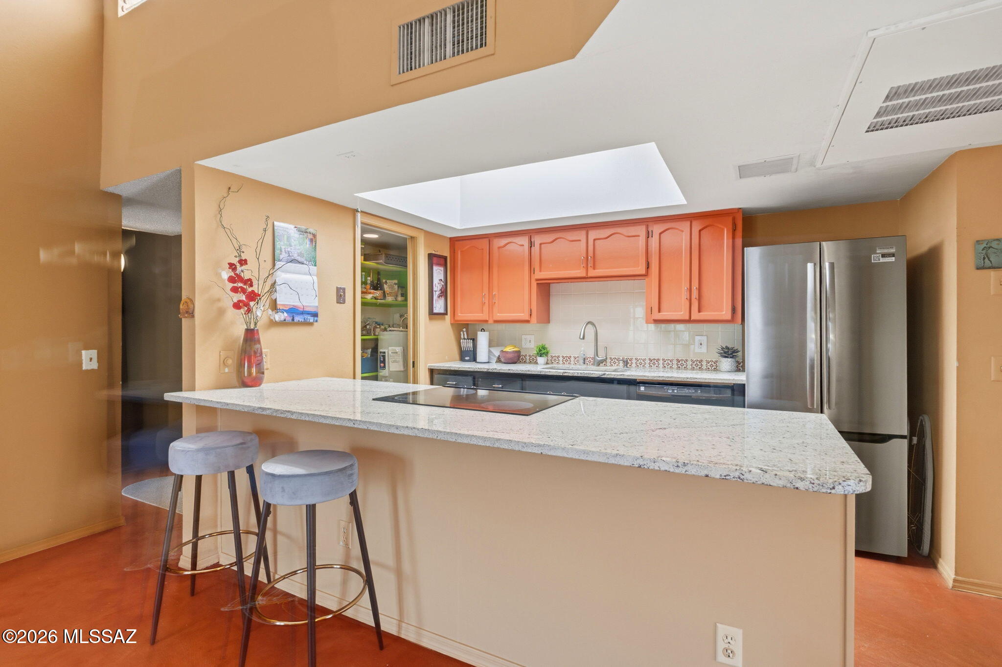 1200 East River Road, Unit G87 Tucson, AZ 85718 - Photo 10 of 30 a kitchen with stainless steel appliances granite countertop a refrigerator and a sink