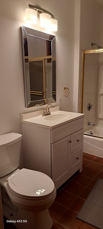 24 Clearview Avenue, Unit 2 Worcester, MA 01605 - Photo 22 of 32 a bathroom with a toilet sink and mirror