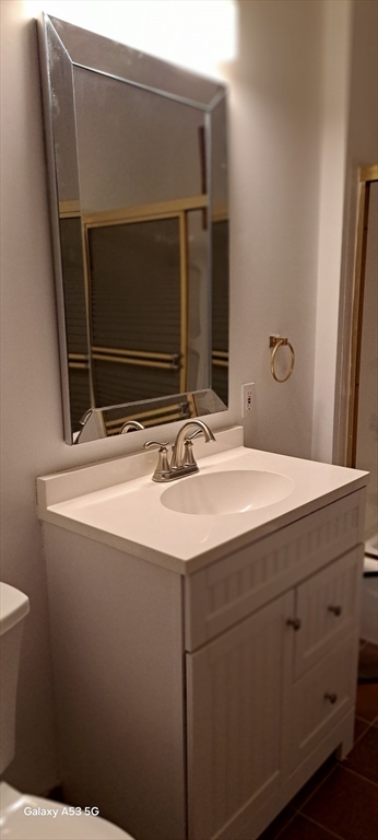 24 Clearview Avenue, Unit 2 Worcester, MA 01605 - Photo 24 of 32 a bathroom with a sink and a mirror