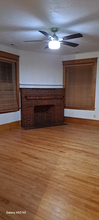 24 Clearview Avenue, Unit 2 Worcester, MA 01605 - Photo 25 of 32 a view of an empty room with wooden floor and a ceiling fan