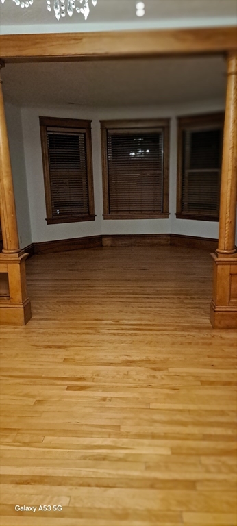 24 Clearview Avenue, Unit 2 Worcester, MA 01605 - Photo 28 of 32 a living room with a wooden floor and a fireplace