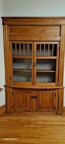 a view of a room with wooden floor and windows