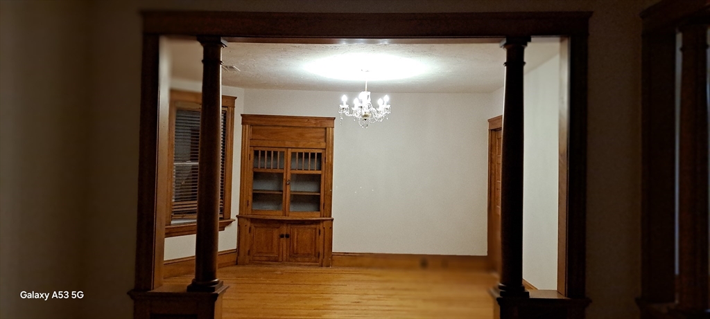 24 Clearview Avenue, Unit 2 Worcester, MA 01605 - Photo 31 of 32 a view of a room with wooden floor and windows