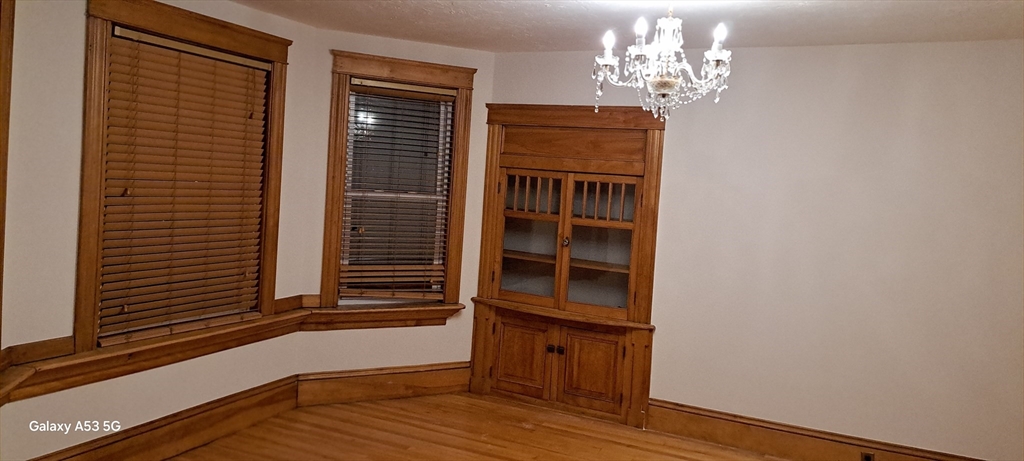 24 Clearview Avenue, Unit 2 Worcester, MA 01605 - Photo 32 of 32 a view of empty room with wooden floor and fan