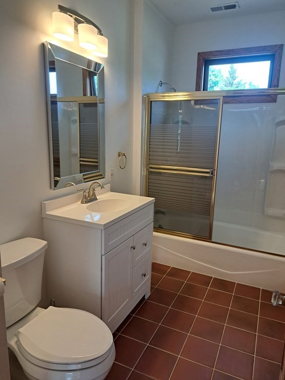 24 Clearview Avenue, Unit 2 Worcester, MA 01605 - Photo 6 of 32 a bathroom with a sink a toilet and mirror
