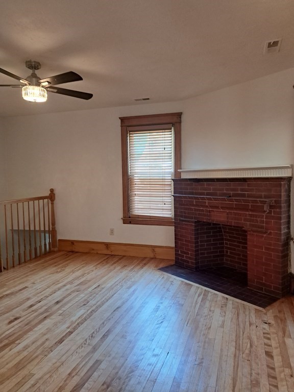 24 Clearview Avenue, Unit 2 Worcester, MA 01605 - Photo 8 of 32 a view of an empty room with wooden floor and a window