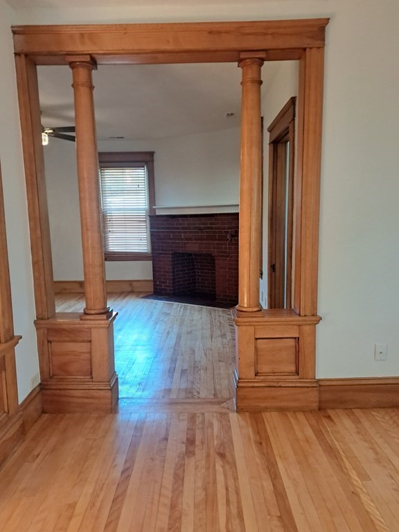 24 Clearview Avenue, Unit 2 Worcester, MA 01605 - Photo 10 of 32 wooden floor fireplace and natural light