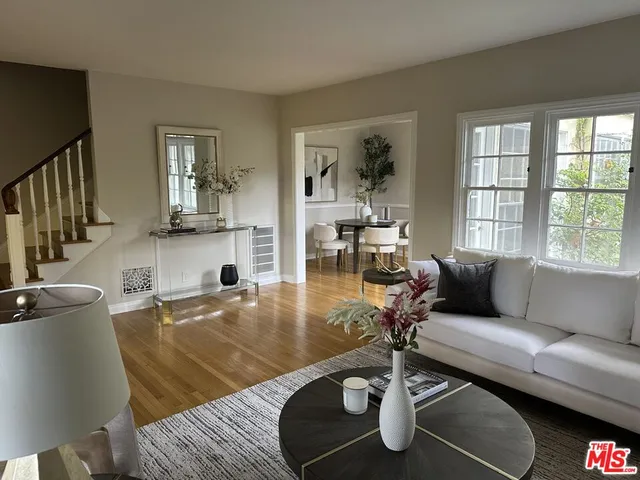 a living room with a couch and a large window