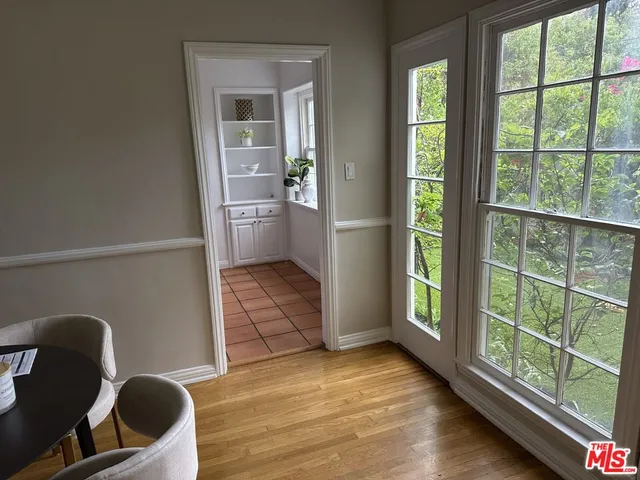 a view of livingroom with furniture and a large window