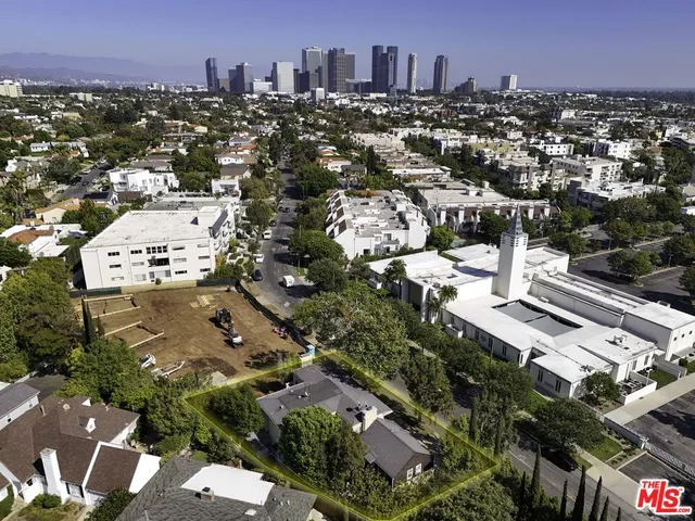 an aerial view of a city with lots of residential buildings