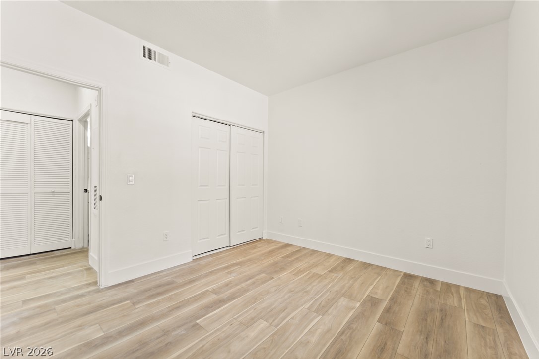 4730 East Craig Road, Unit 1053 Las Vegas, NV 89115 - Photo 8 of 32 Clean lines and a light wood floor create an inviting, adaptable space.