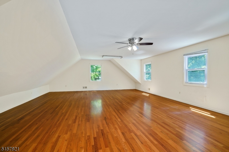 22 Court Road Morris Plains, NJ 07950 - Photo 13 of 28 wooden floor in an empty room with a window