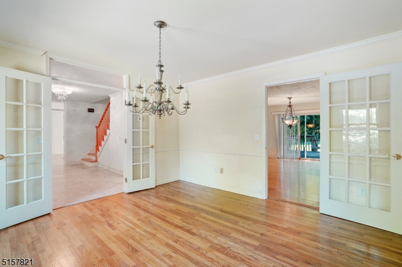 22 Court Road Morris Plains, NJ 07950 - Photo 6 of 28 a view of a livingroom with wooden floor and a ceiling fan