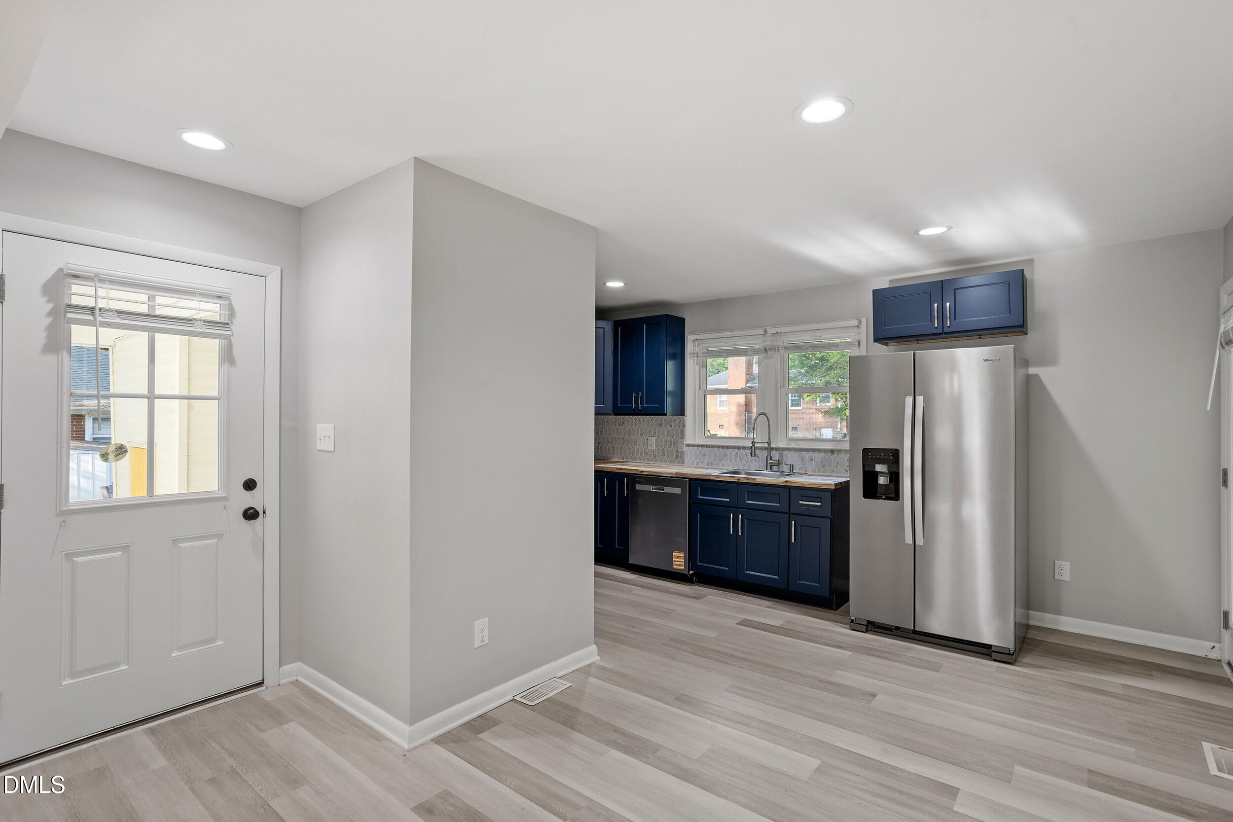 2414 Chapin Street Durham, NC 27707 - Photo 11 of 30 a kitchen with stainless steel appliances granite countertop a refrigerator and a stove top oven