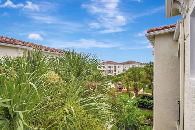 a view of a kitchen with a sink and a refrigerator
