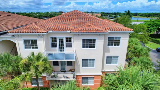 a aerial view of a house with a yard and plants