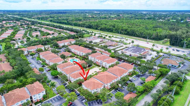 a view of an house with swimming pool and furniture
