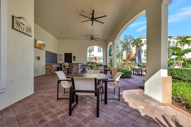 a workspace with furniture and next to a window