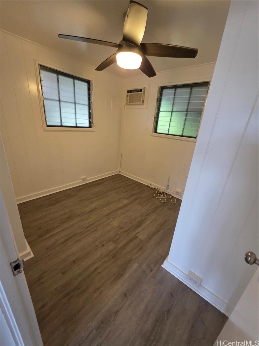 45-557 Keaahala Road, Unit K Kaneohe, HI 96744 - Photo 11 of 20 wooden floor in an empty room with a window