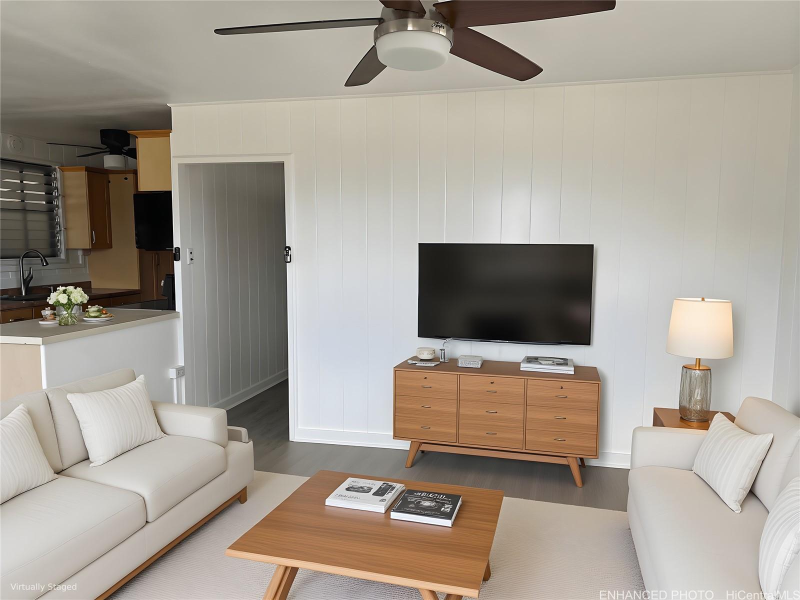 45-557 Keaahala Road, Unit K Kaneohe, HI 96744 - Photo 16 of 20 a living room with furniture and a flat screen tv