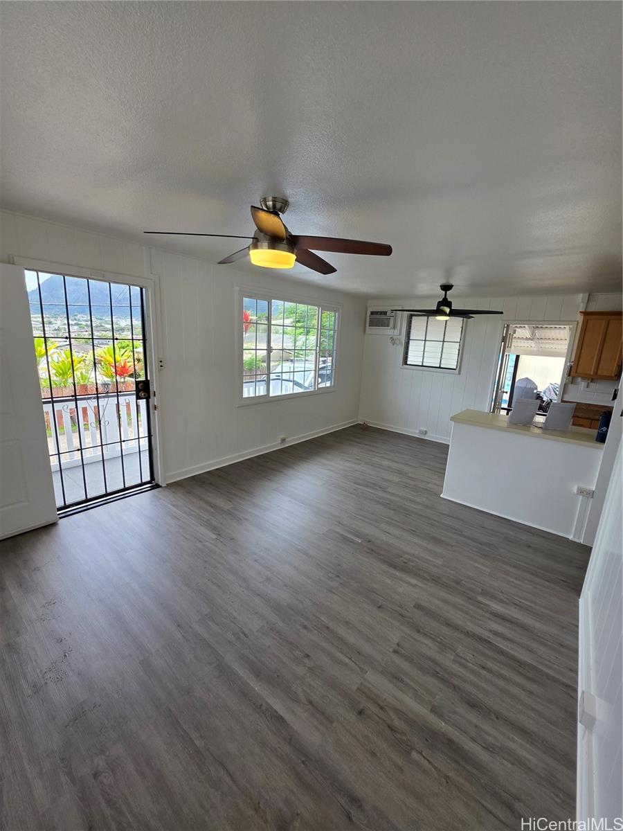 45-557 Keaahala Road, Unit K Kaneohe, HI 96744 - Photo 17 of 20 wooden floor in an empty room with a window