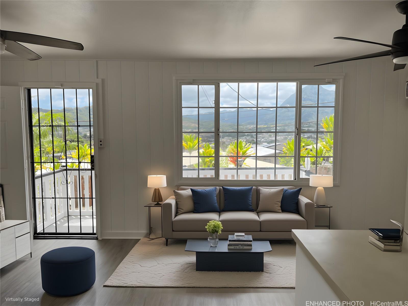 45-557 Keaahala Road, Unit K Kaneohe, HI 96744 - Photo 2 of 20 a living room with furniture and a large window