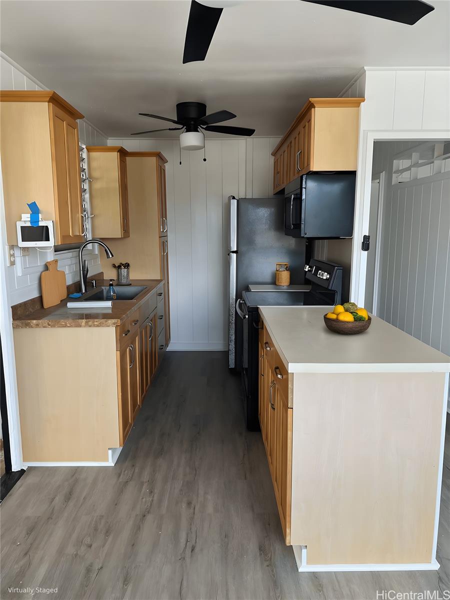 45-557 Keaahala Road, Unit K Kaneohe, HI 96744 - Photo 4 of 20 a kitchen with a stove a refrigerator and a sink