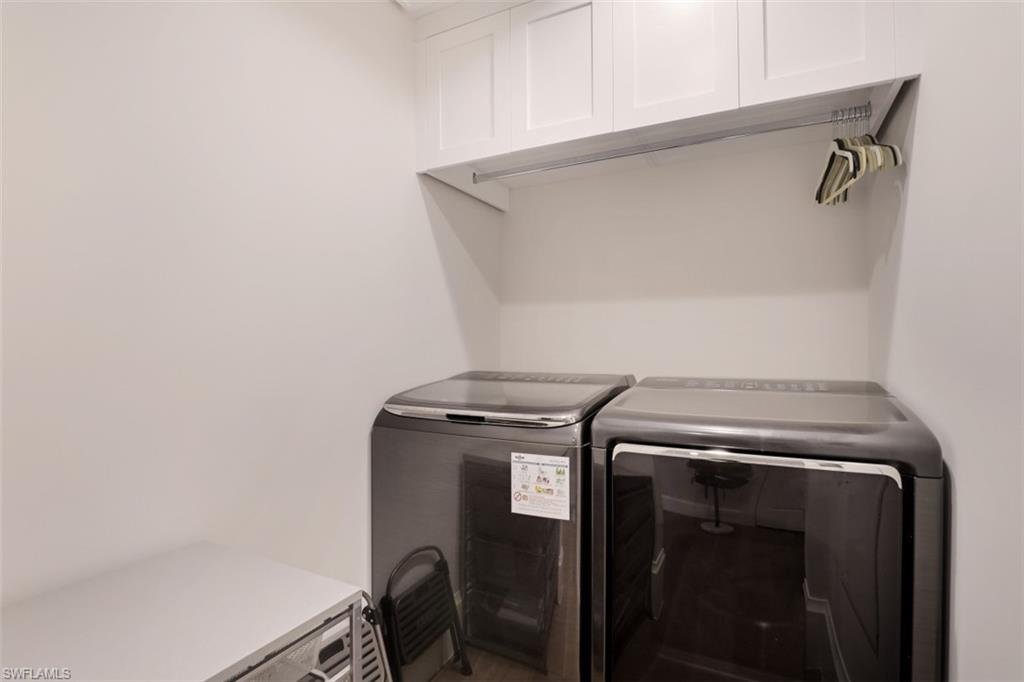 549 Neapolitan Way Naples, FL 34103 - Photo 29 of 35 a utility room with dryer and washer