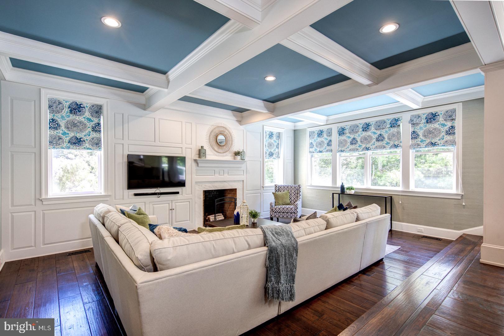 121 Brooke Farm Road Wayne, PA 19087 - Photo 15 of 46 a living room with furniture a flat screen tv and a fireplace