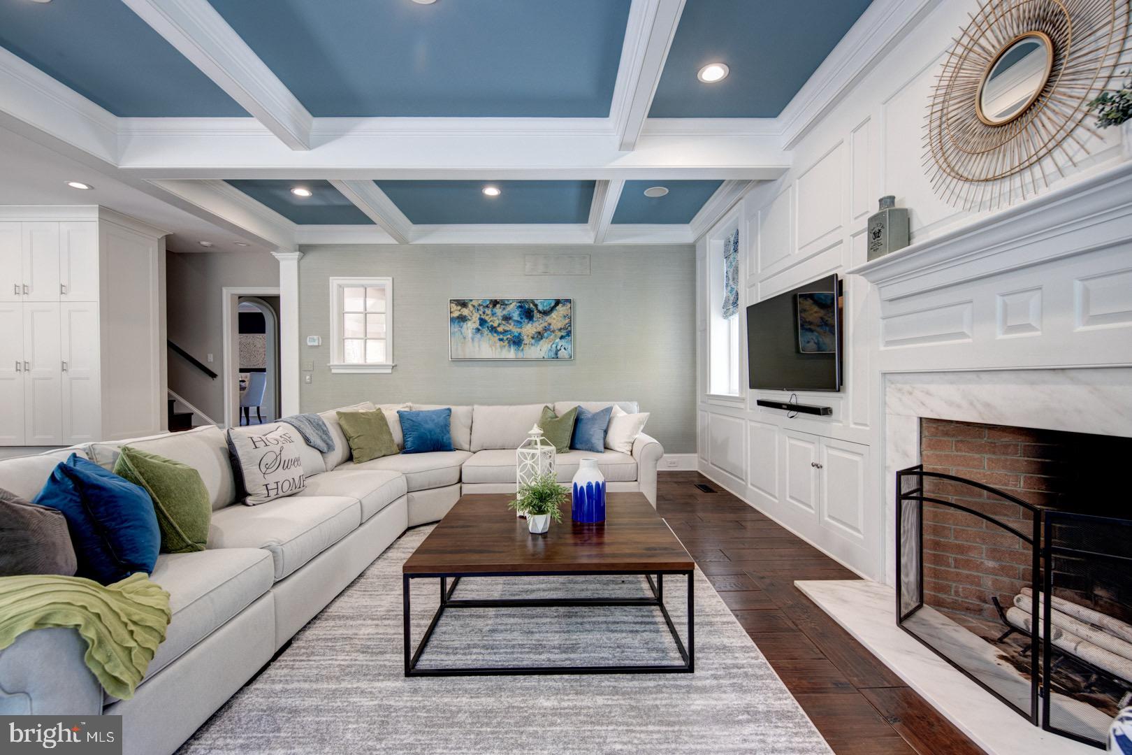 121 Brooke Farm Road Wayne, PA 19087 - Photo 16 of 46 a living room with furniture a flat screen tv and a fireplace