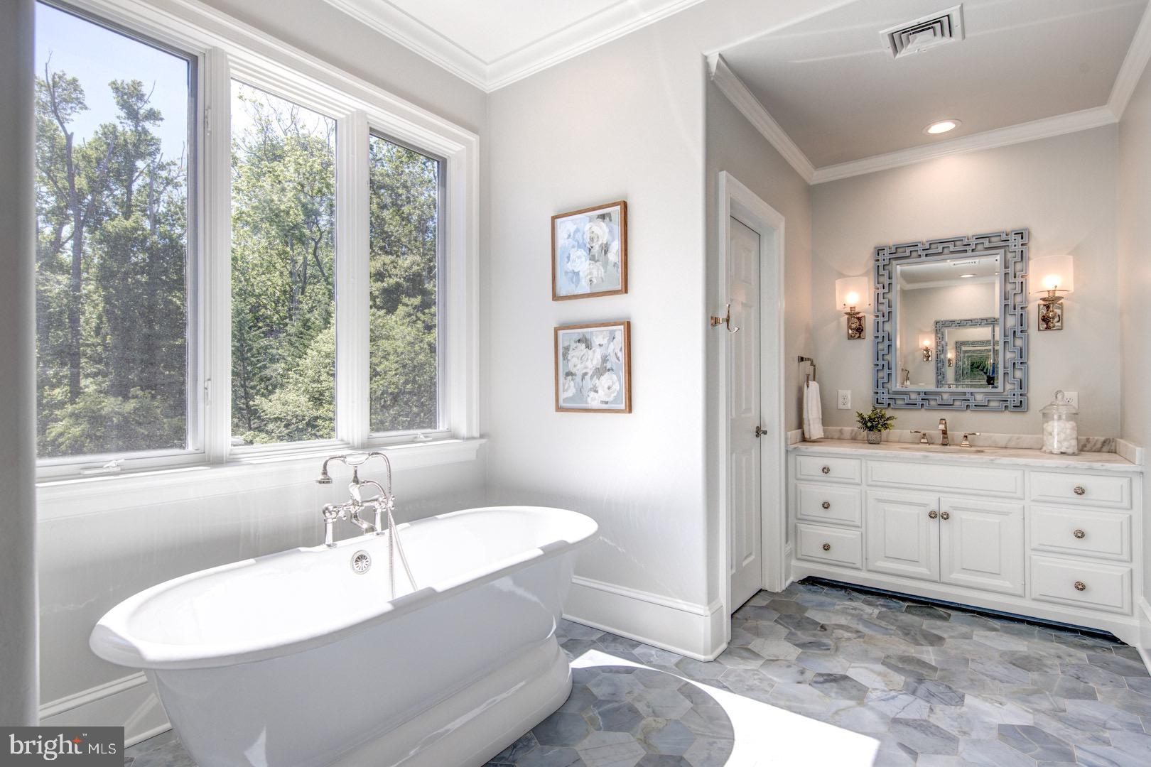 121 Brooke Farm Road Wayne, PA 19087 - Photo 26 of 46 a spacious bathroom with a tub sink and mirror
