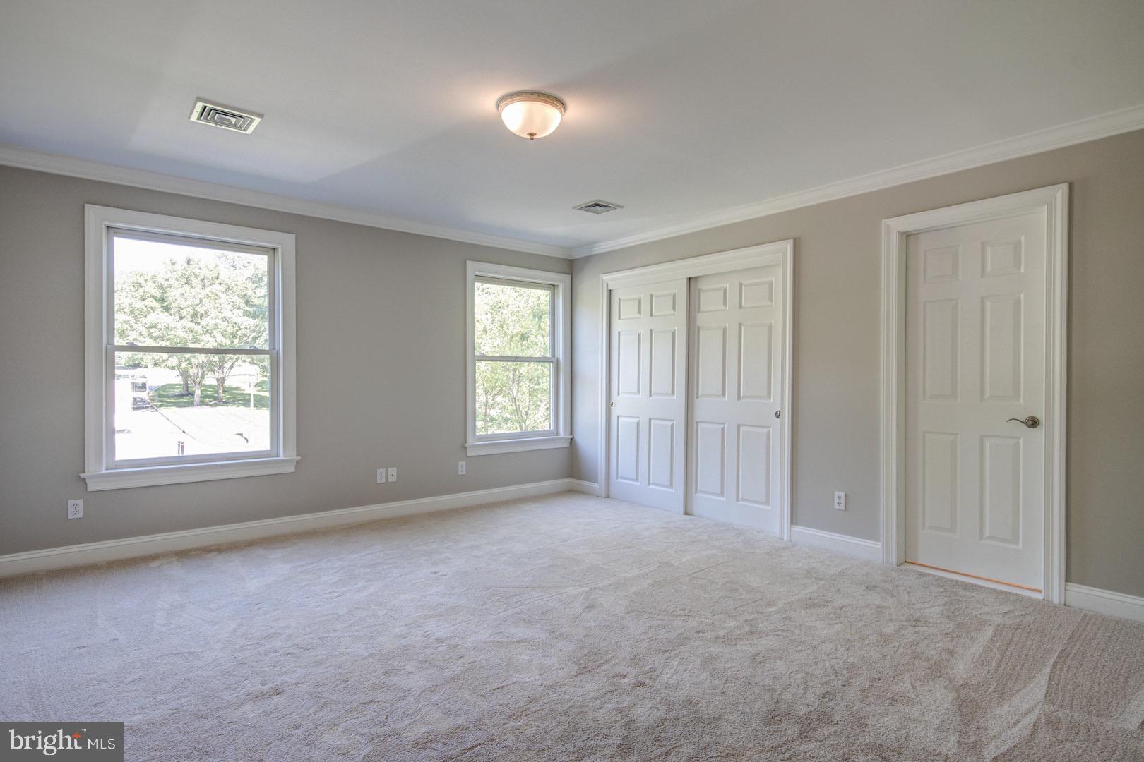 121 Brooke Farm Road Wayne, PA 19087 - Photo 29 of 46 an empty room with windows and closet