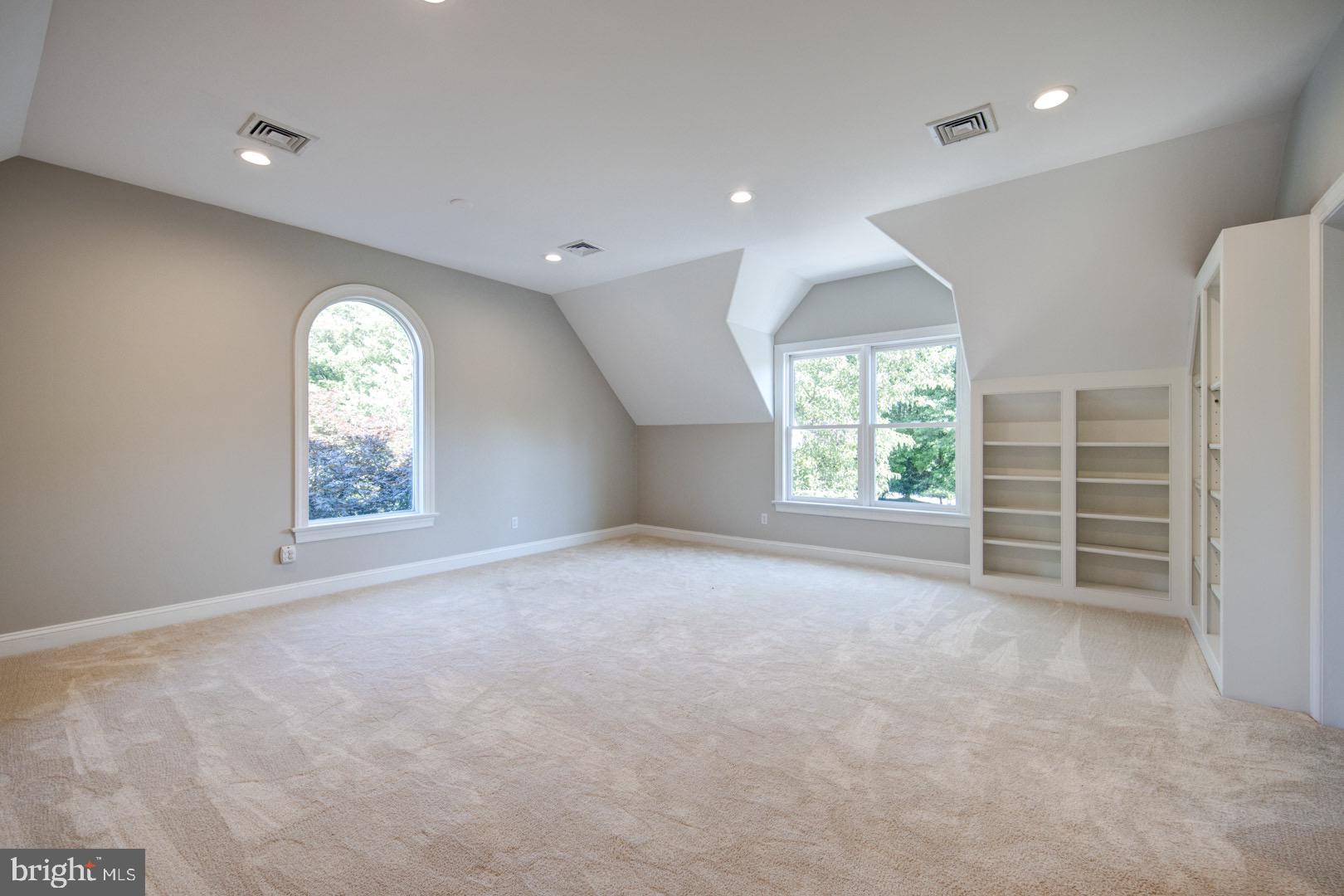 121 Brooke Farm Road Wayne, PA 19087 - Photo 34 of 46 an empty room with windows closet and fireplace