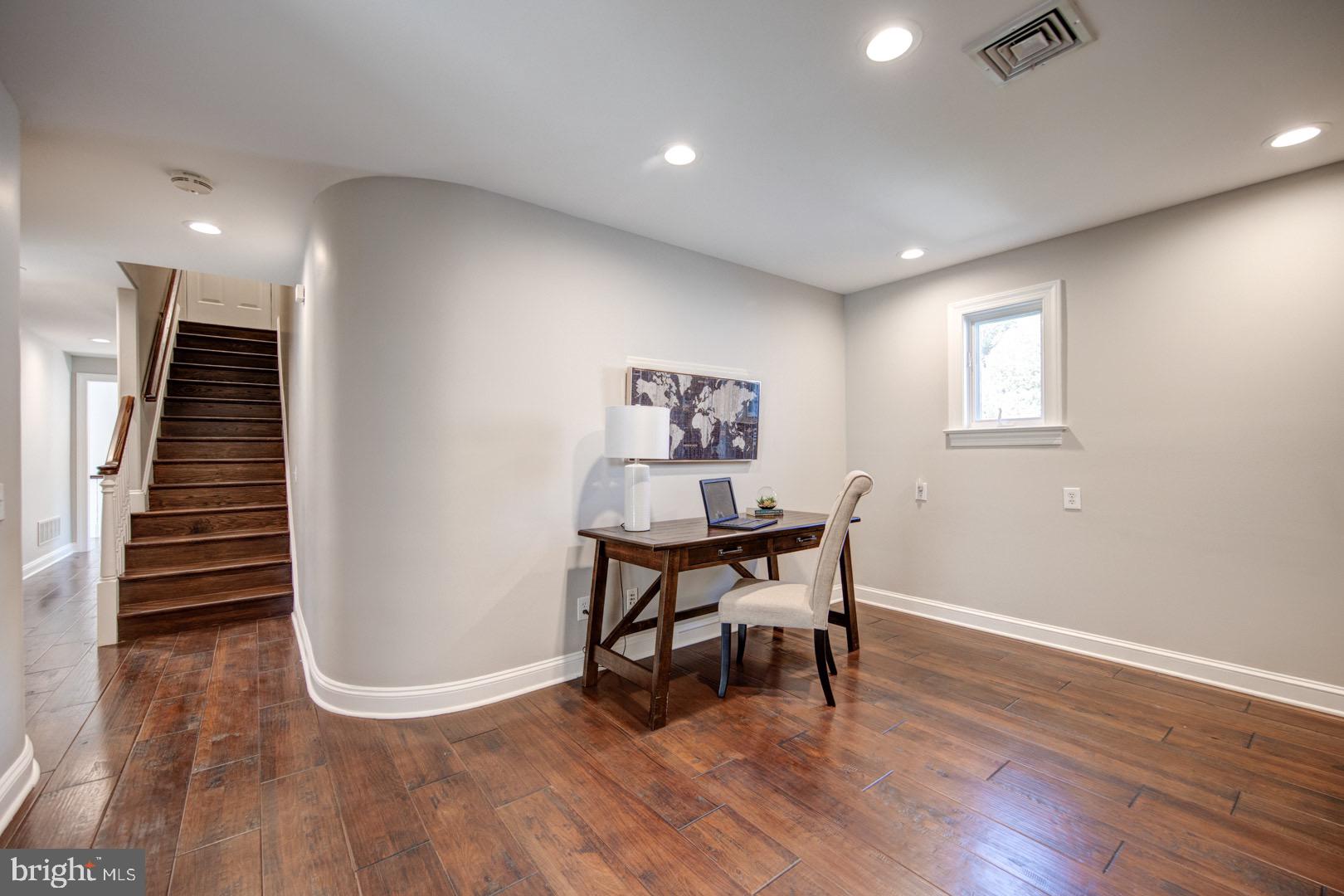 121 Brooke Farm Road Wayne, PA 19087 - Photo 37 of 46 a view of a hallway with wooden floor and stairs