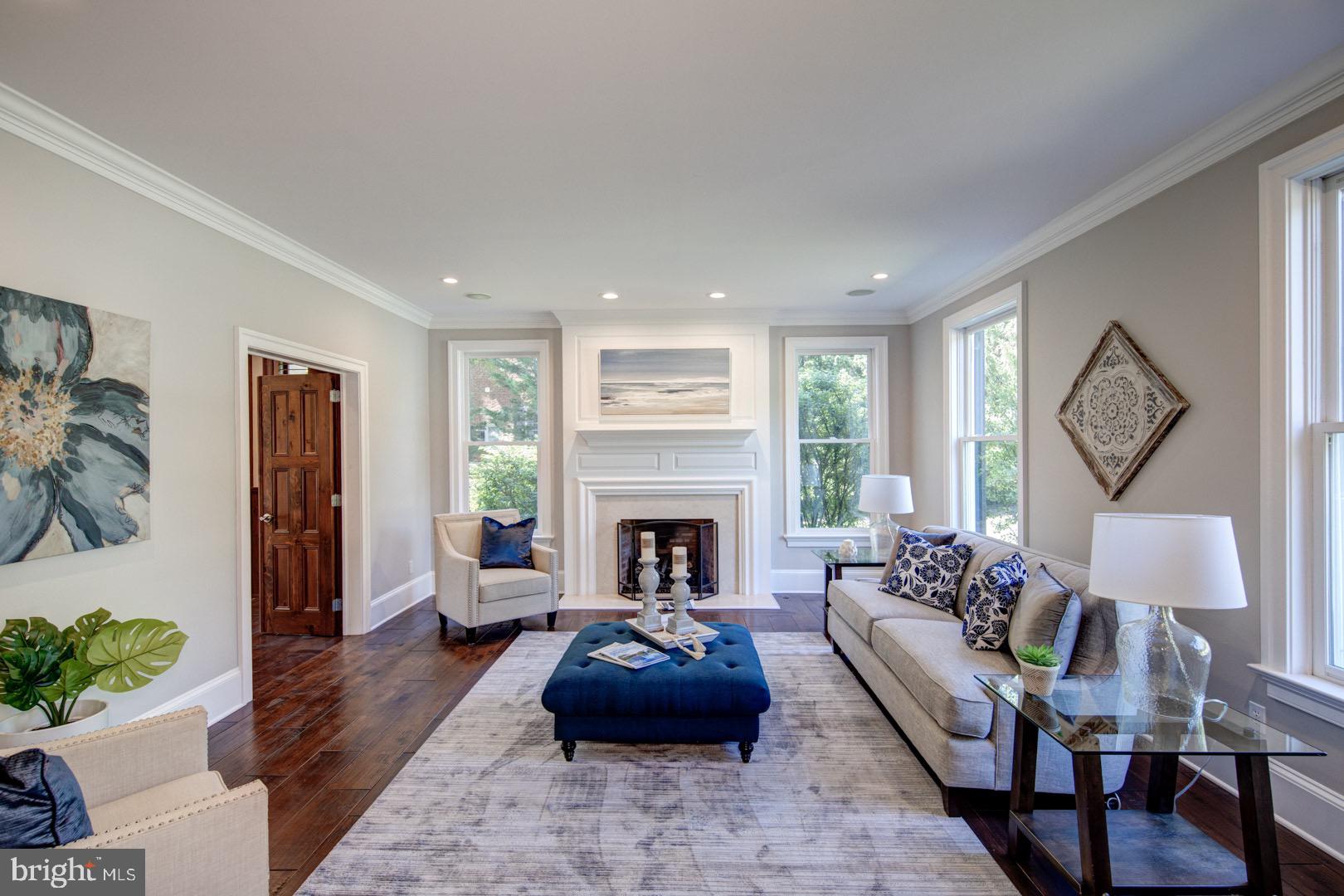 121 Brooke Farm Road Wayne, PA 19087 - Photo 5 of 46 a living room with furniture fireplace and a large window