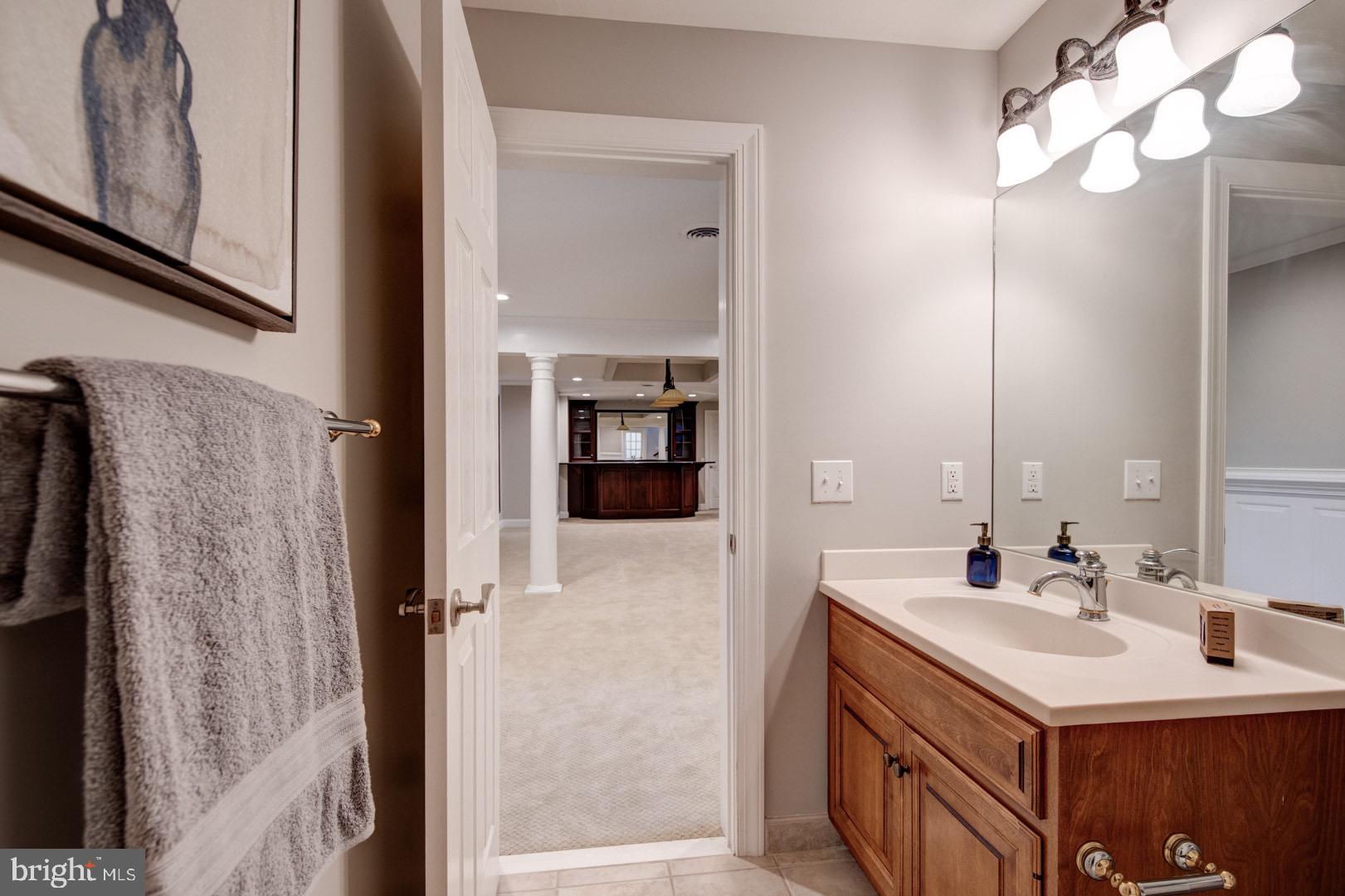 121 Brooke Farm Road Wayne, PA 19087 - Photo 43 of 46 a bathroom with a sink vanity and a mirror
