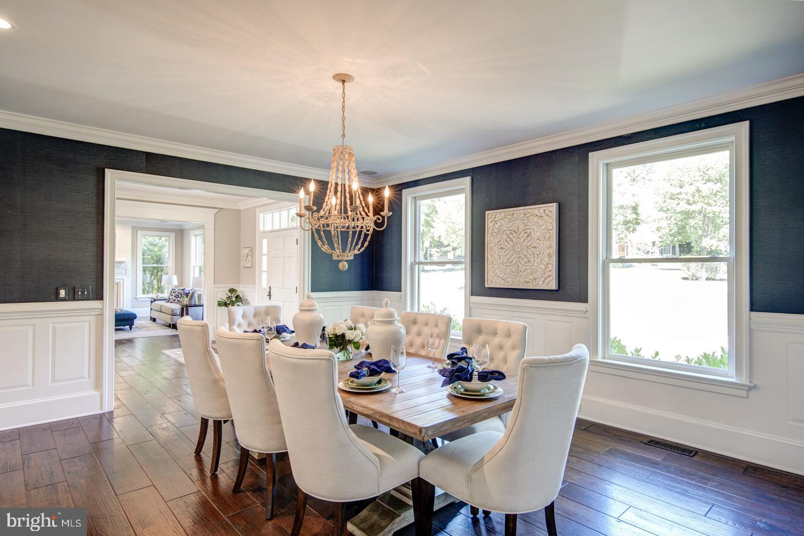 121 Brooke Farm Road Wayne, PA 19087 - Photo 9 of 46 a view of a dining room with furniture window and wooden floor