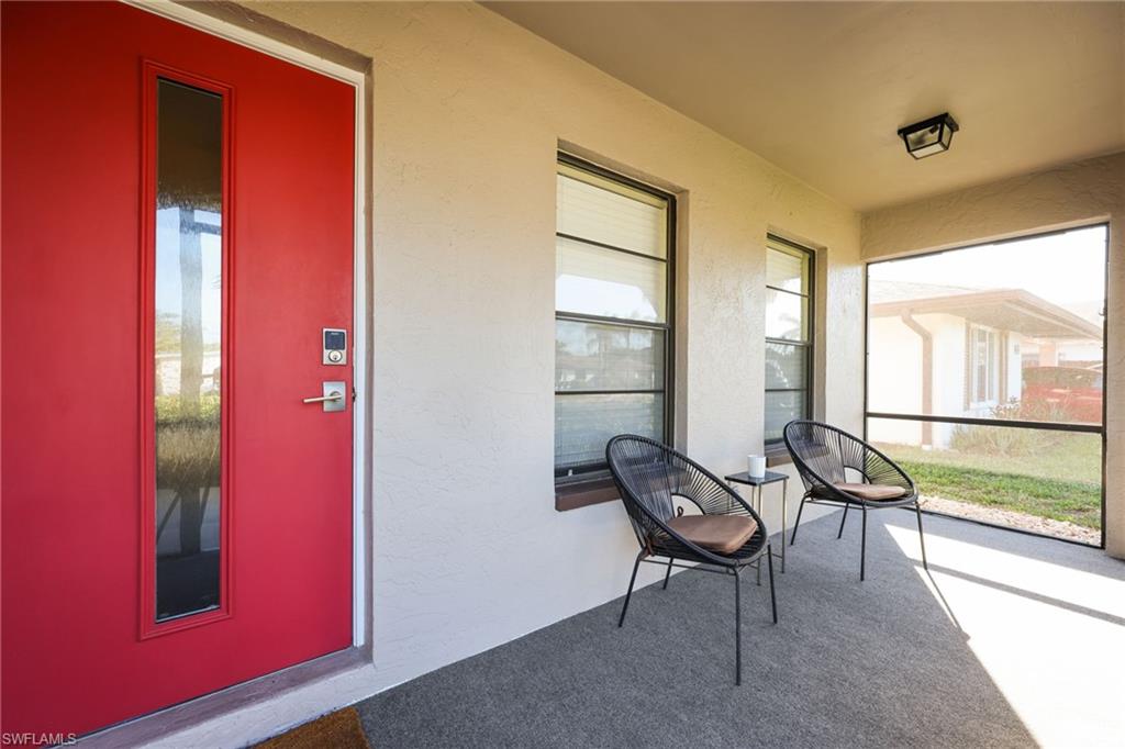 648 96th Avenue North Naples, FL 34108 - Photo 33 of 37 Front Door_Lanai
