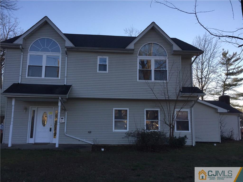 65 Idlewild Road Edison, NJ 08817 - Photo 1 of 21 a front view of a house with a yard