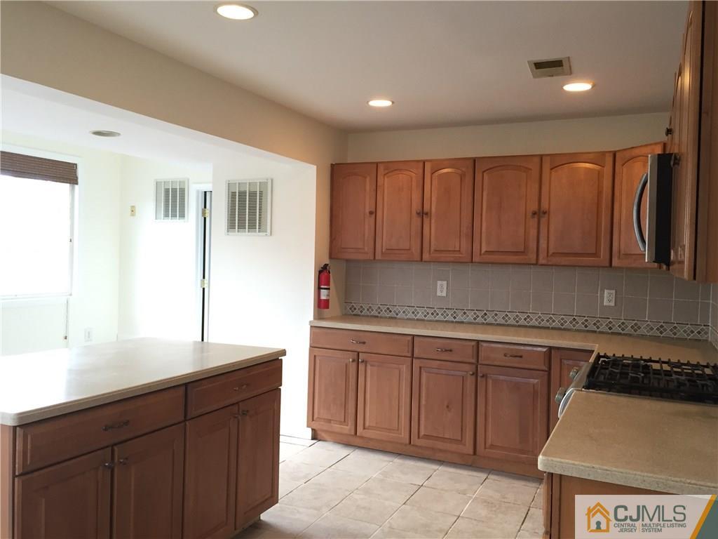 65 Idlewild Road Edison, NJ 08817 - Photo 2 of 21 a kitchen with a sink and cabinets