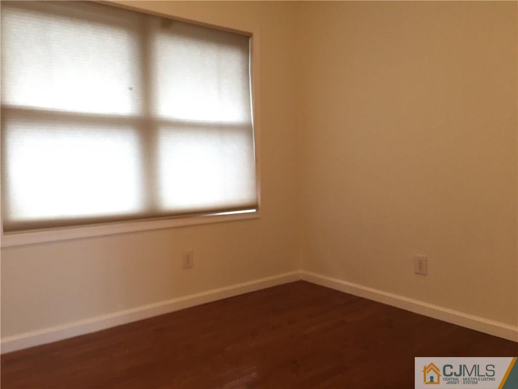 65 Idlewild Road Edison, NJ 08817 - Photo 21 of 21 a view of an empty room with a window