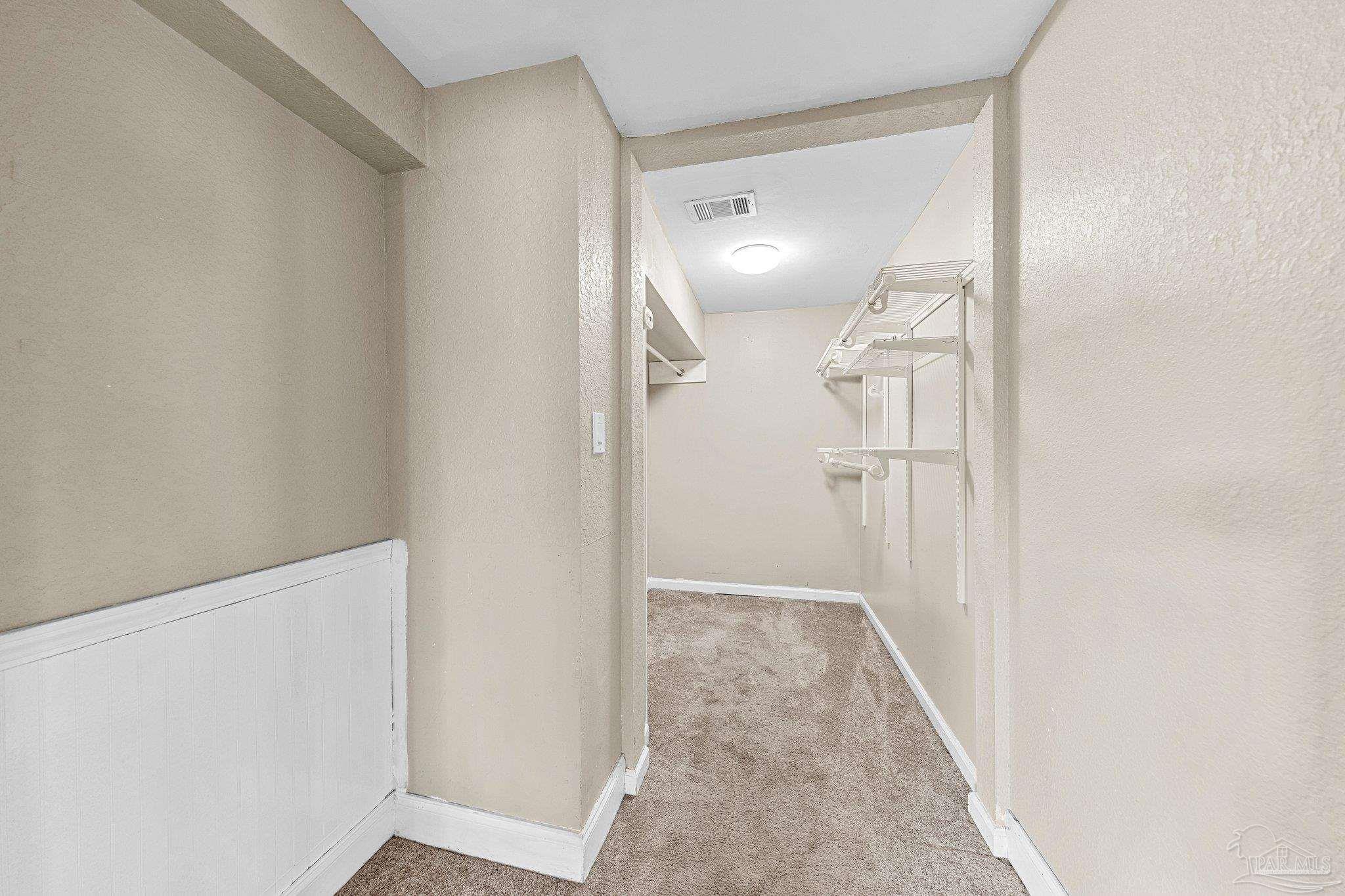 162 West Burgess Road Pensacola, FL 32503 - Photo 18 of 30 a view of a hallway with wooden floor