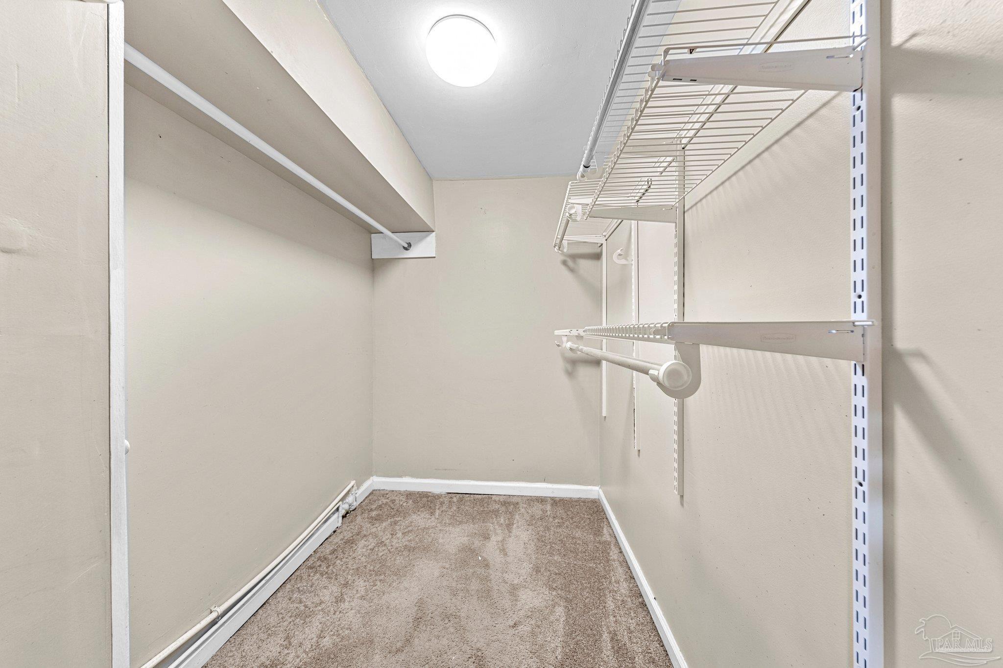 162 West Burgess Road Pensacola, FL 32503 - Photo 19 of 30 a view of walk in closet with empty racks